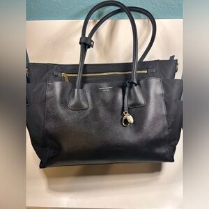 Henri Bendel black leather West 57th shoulder.  Purple lining, dustcover